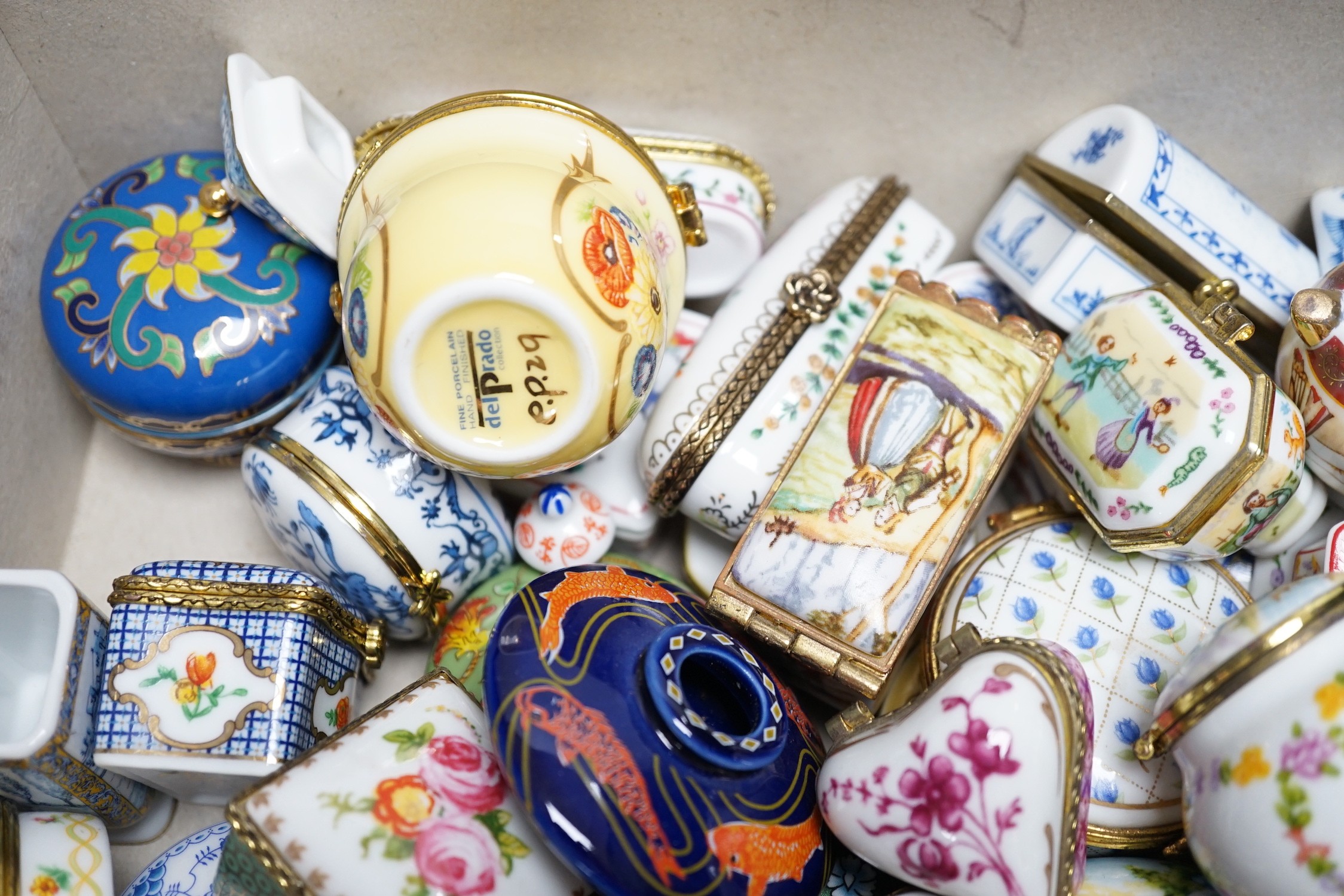 A quantity of approximately sixty Del Prado oriental and classic collection porcelain boxes, together with accompanying book and ephemera